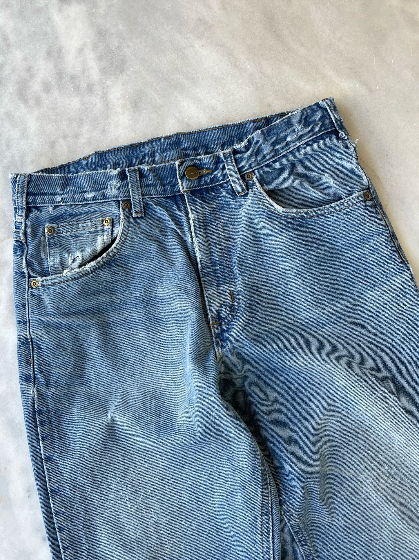 CARHARTT DISTRESSED DENIM PANTS WITH CUTS