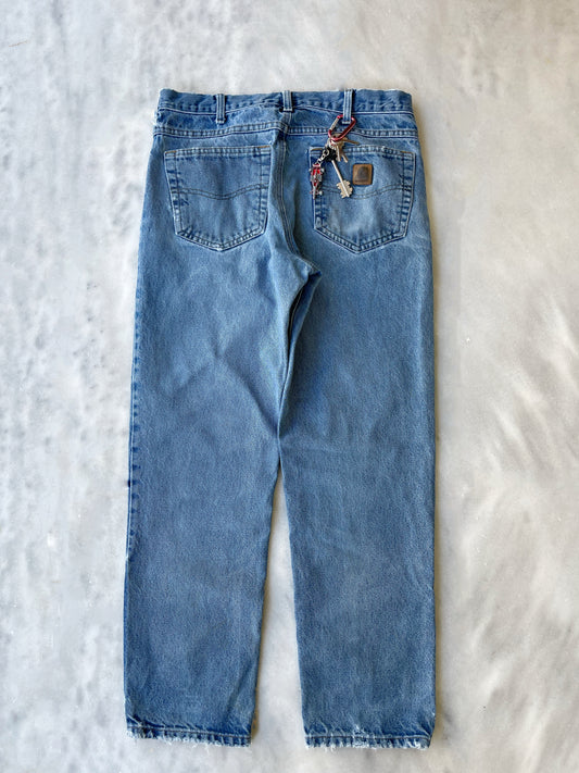 CARHARTT DISTRESSED DENIM PANTS WITH CUTS